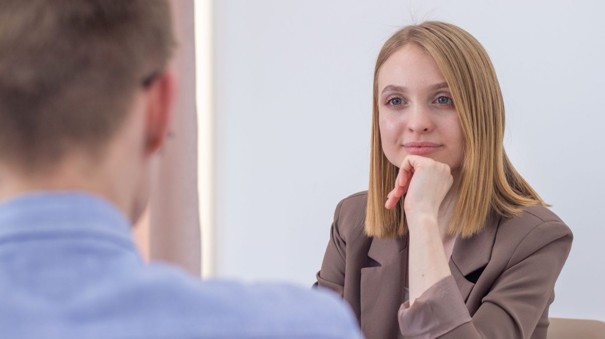 Colleague listening intently and adapting tone during a conversation in an office setting