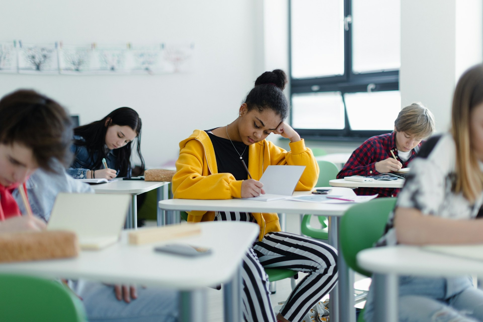 High school students working on assignments at their desks